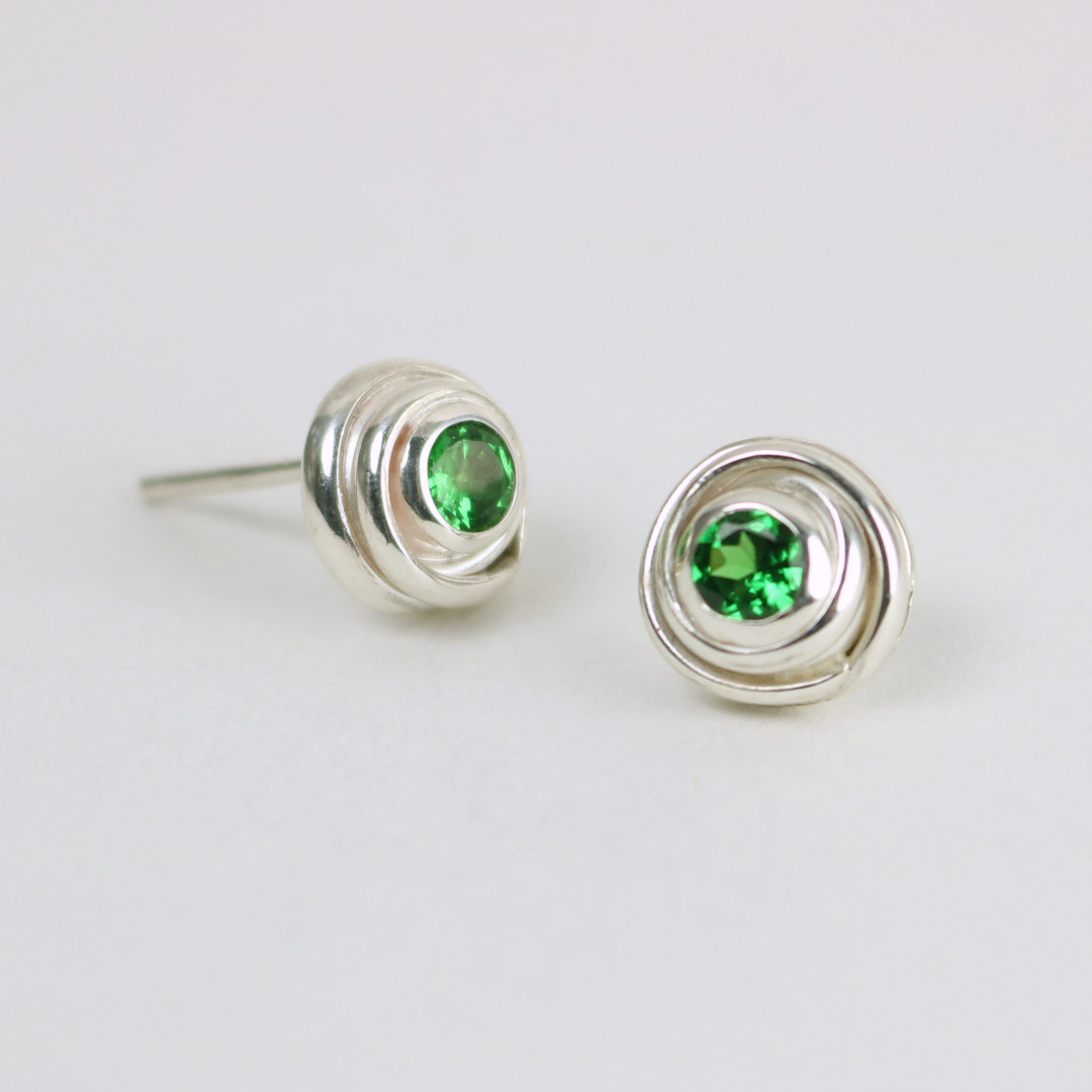 Earrings in silver with tsavorite gemstones Earrings in silver with tsavorite gemstones