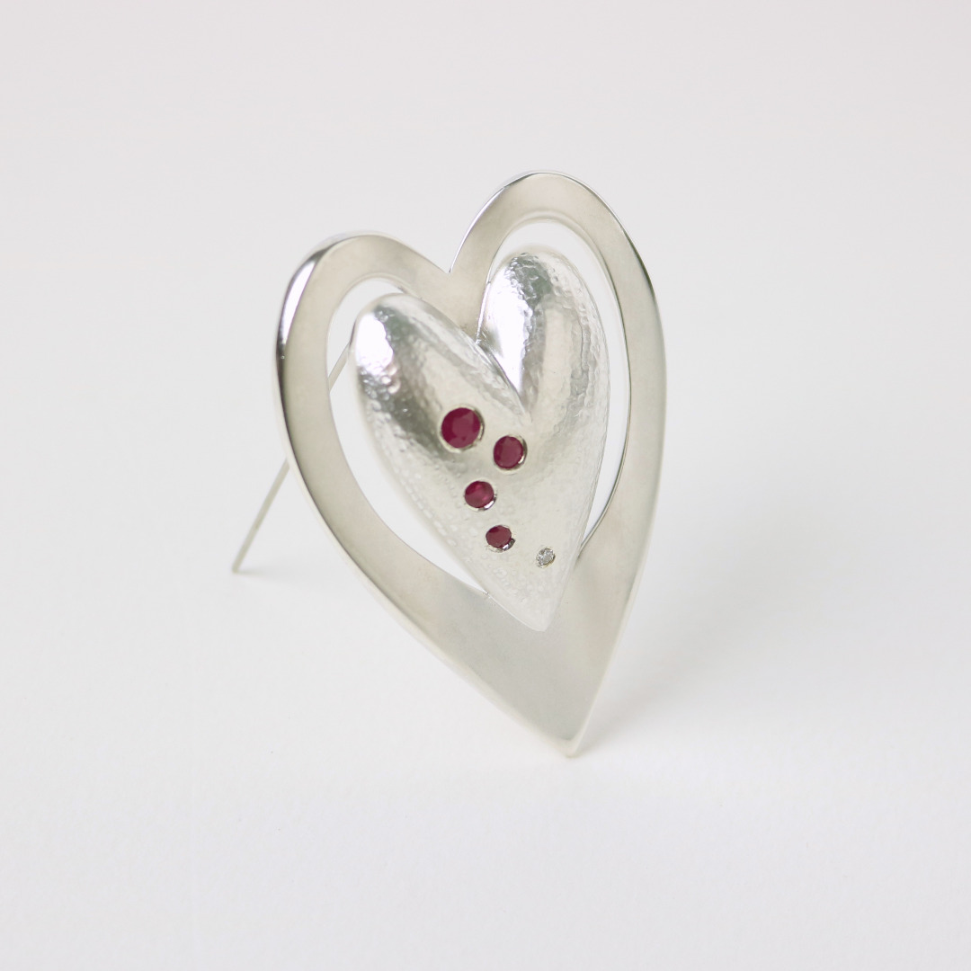 brooch in silver set with rubies and diamond brooch in silver set with rubies and diamond