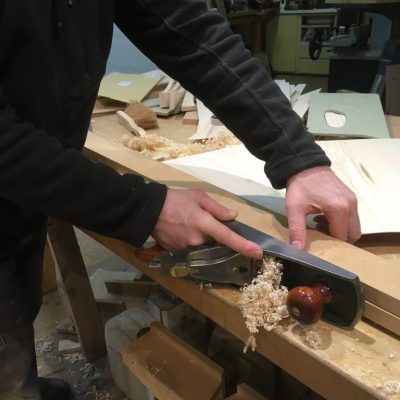 Planing veneer panels to be used in the Sunburst dining suite