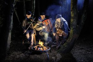 Musicians, "Firelight Trio" in the woods at night