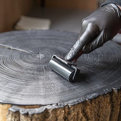 Inking up wood block in studio Inking up wood block in studio